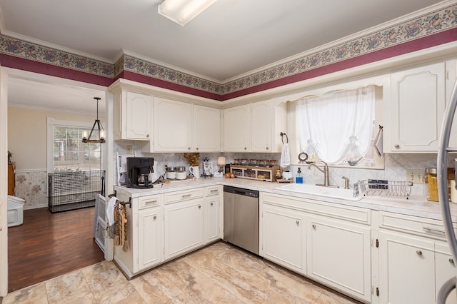 kitchen with dishwasher, sink, light hardwood / wood-style floors, decorative light fixtures, and white cabinets