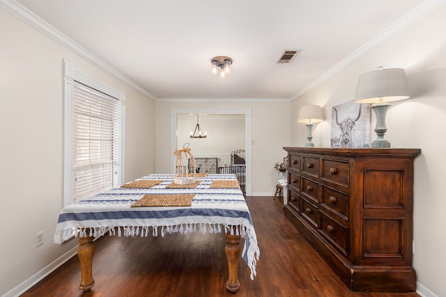 bedroom featuring crown molding and dark wood-type flooring