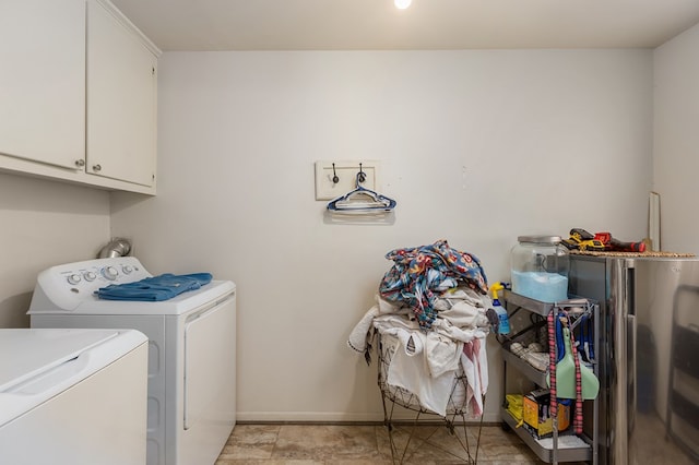 laundry area with cabinets and washer and dryer