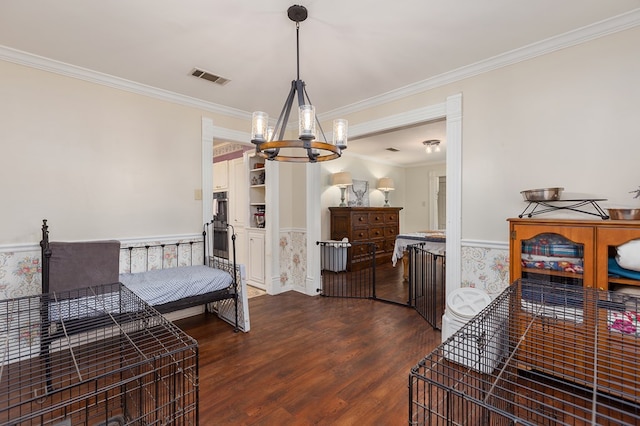 bedroom featuring dark hardwood / wood-style floors, an inviting chandelier, and crown molding