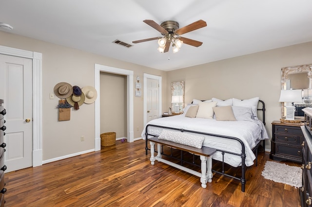 bedroom with ceiling fan and dark hardwood / wood-style flooring