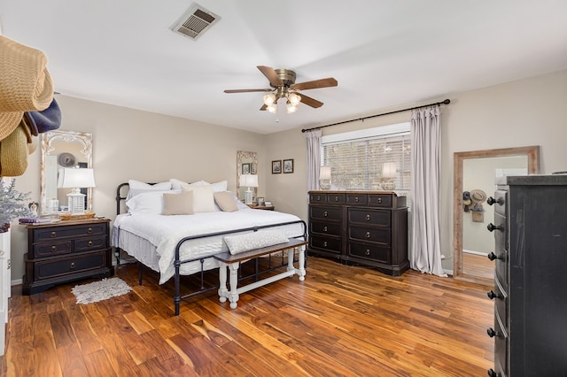 bedroom featuring dark hardwood / wood-style floors and ceiling fan