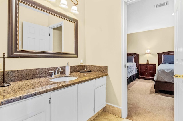 bathroom featuring tile patterned floors and vanity