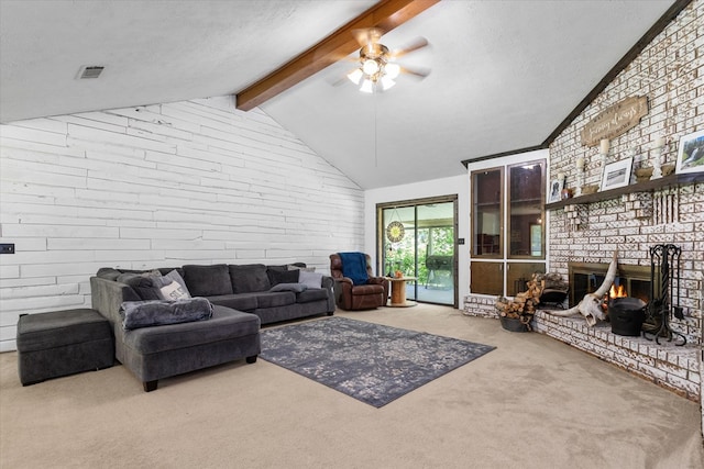 carpeted living room with a fireplace, a textured ceiling, lofted ceiling with beams, and ceiling fan