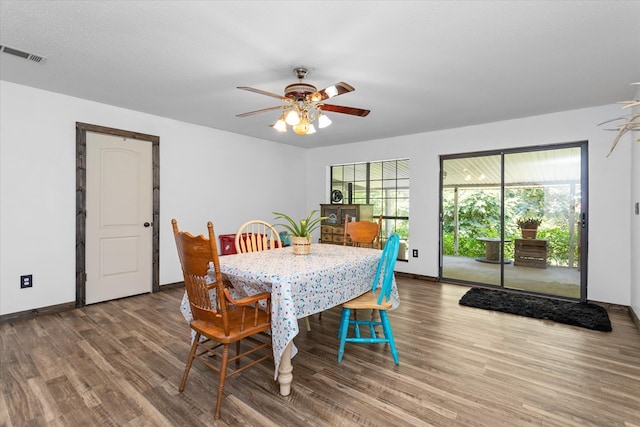 dining space featuring ceiling fan, a textured ceiling, and hardwood / wood-style flooring