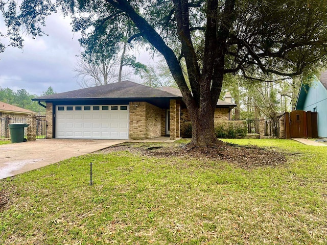 view of front of home with a garage and a front yard