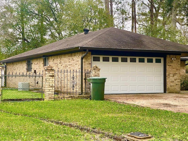 view of home's exterior featuring a yard and a garage