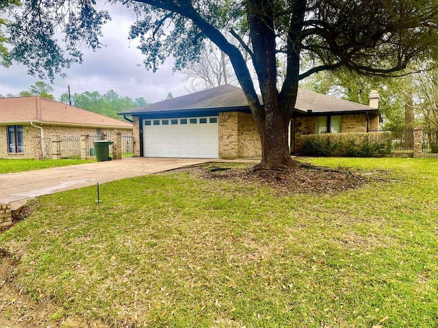 ranch-style home featuring a garage and a front lawn