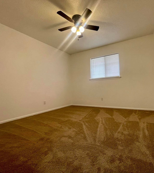 carpeted spare room with a textured ceiling