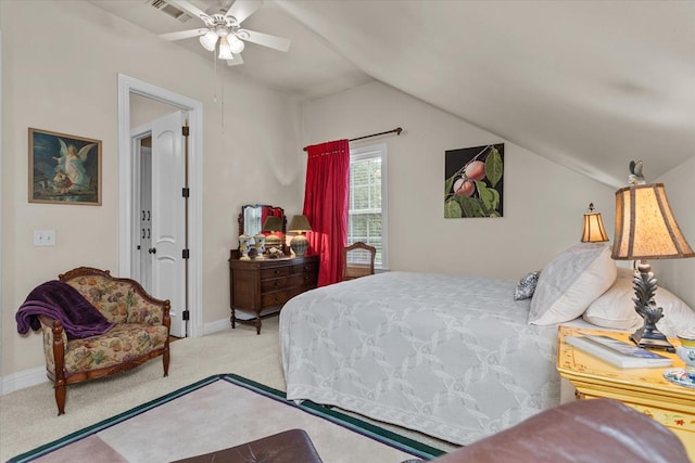 bedroom with ceiling fan, light colored carpet, and vaulted ceiling