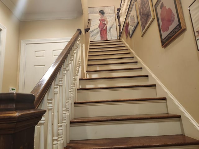 stairs featuring ornamental molding