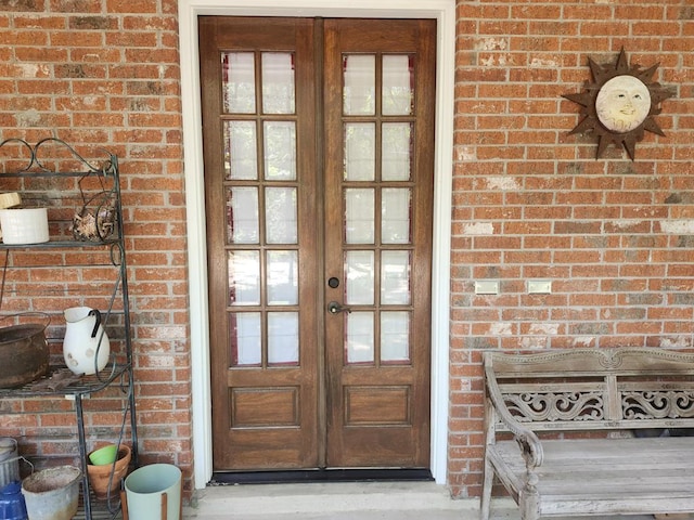 view of exterior entry featuring french doors