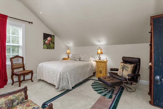 carpeted bedroom with vaulted ceiling