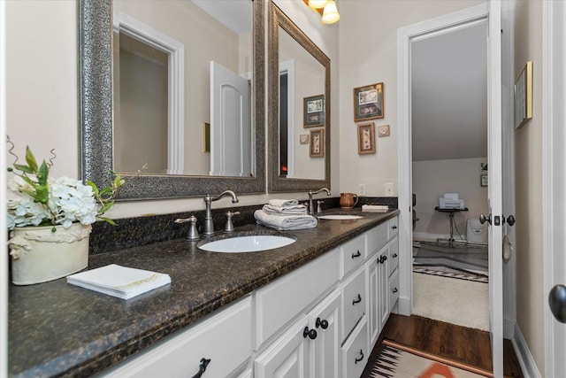 bathroom with wood-type flooring and vanity