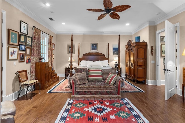 bedroom featuring ceiling fan, dark hardwood / wood-style floors, and ornamental molding