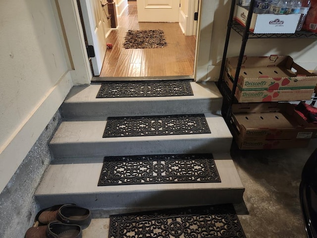 stairs featuring wood-type flooring