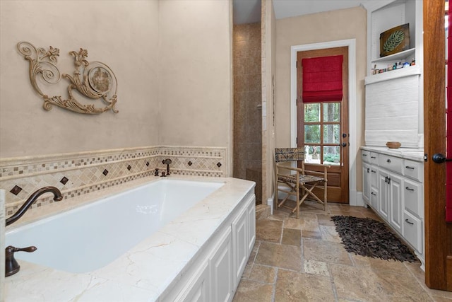 bathroom featuring a tub to relax in