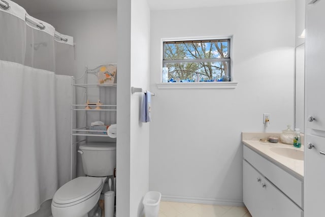 bathroom featuring toilet and vanity