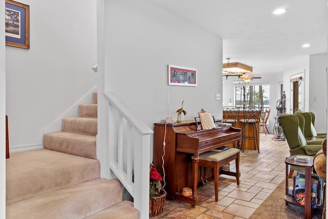 staircase with ceiling fan