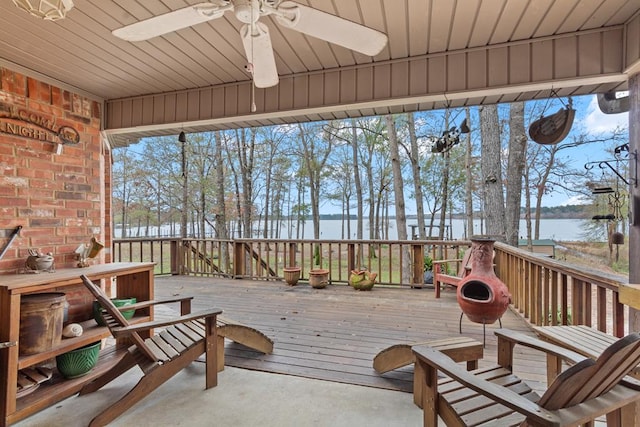 exterior space featuring a water view and ceiling fan