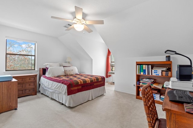 bedroom with ceiling fan, light colored carpet, and vaulted ceiling