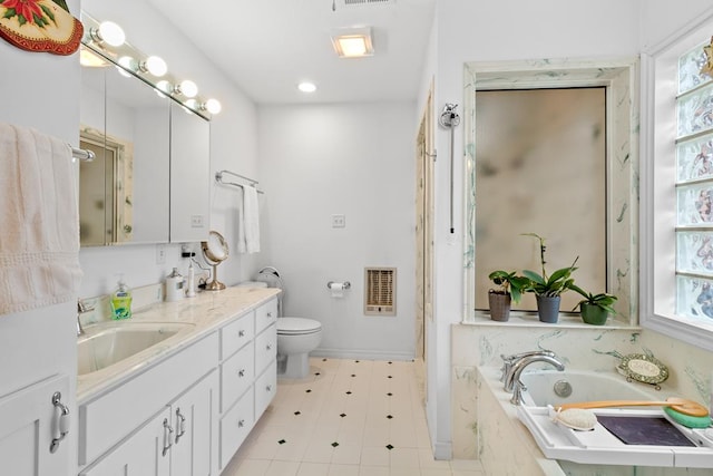 bathroom featuring toilet, a relaxing tiled tub, and vanity