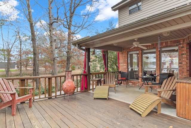 wooden deck featuring ceiling fan