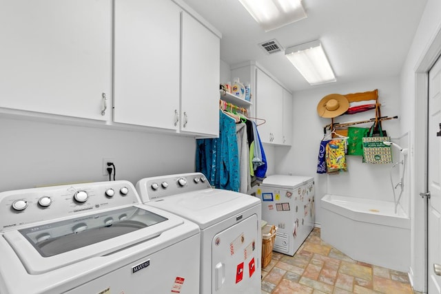 laundry area with independent washer and dryer