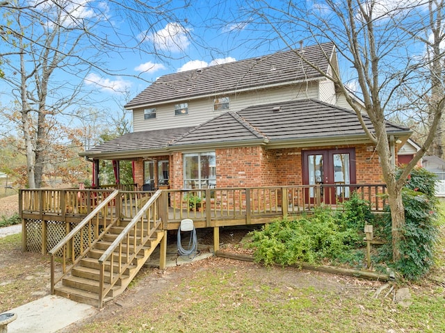 rear view of property with french doors and a deck