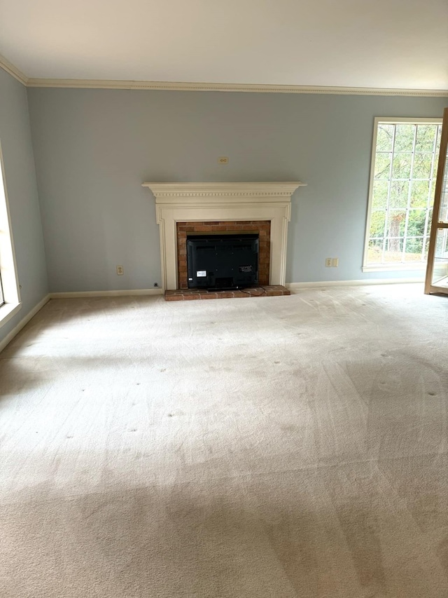 unfurnished living room with light colored carpet and crown molding