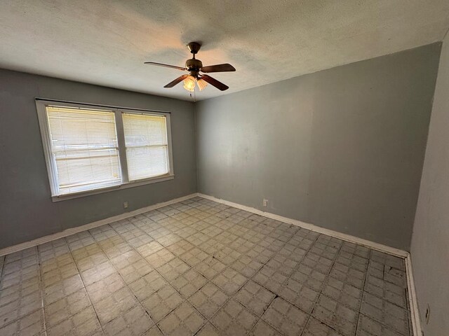 bathroom with tile patterned floors, vanity, a shower with shower door, and toilet