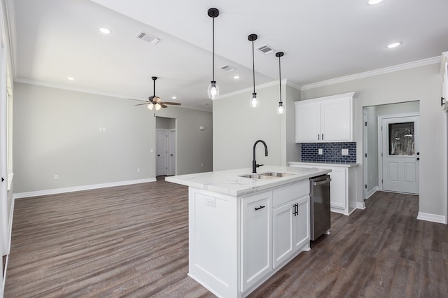 kitchen with dark wood-type flooring, visible vents, a sink, and backsplash