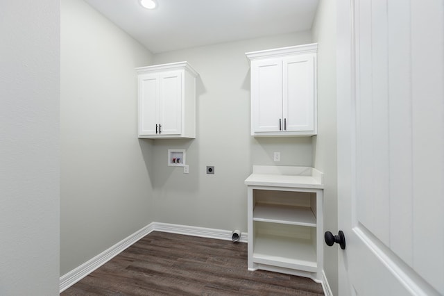 clothes washing area with cabinet space, baseboards, dark wood-style flooring, hookup for a washing machine, and electric dryer hookup