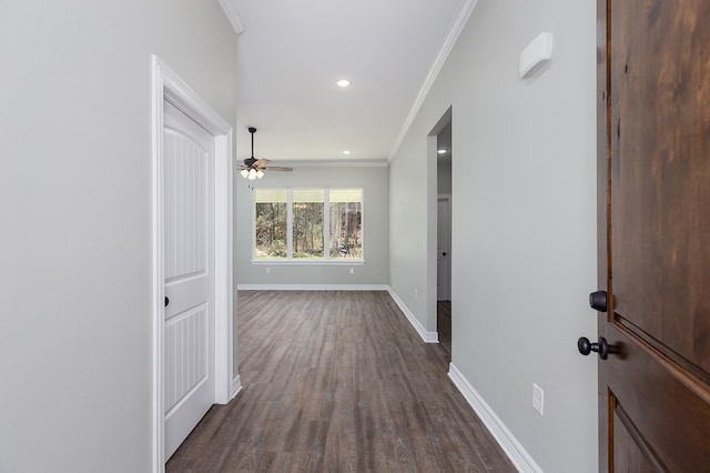 corridor with baseboards, dark wood-type flooring, crown molding, and recessed lighting