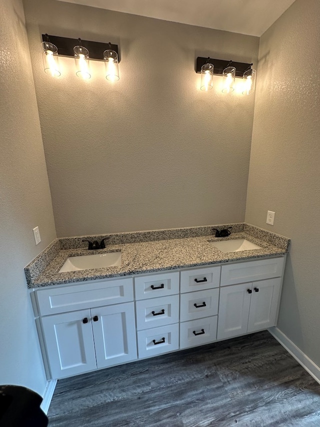 bathroom featuring vanity and hardwood / wood-style flooring