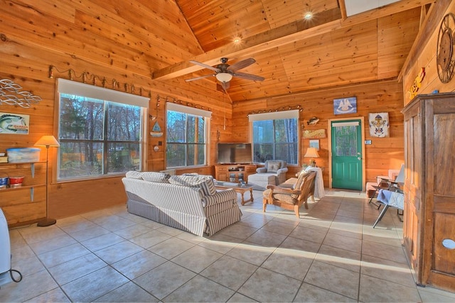 tiled living room with wooden ceiling, wood walls, and high vaulted ceiling