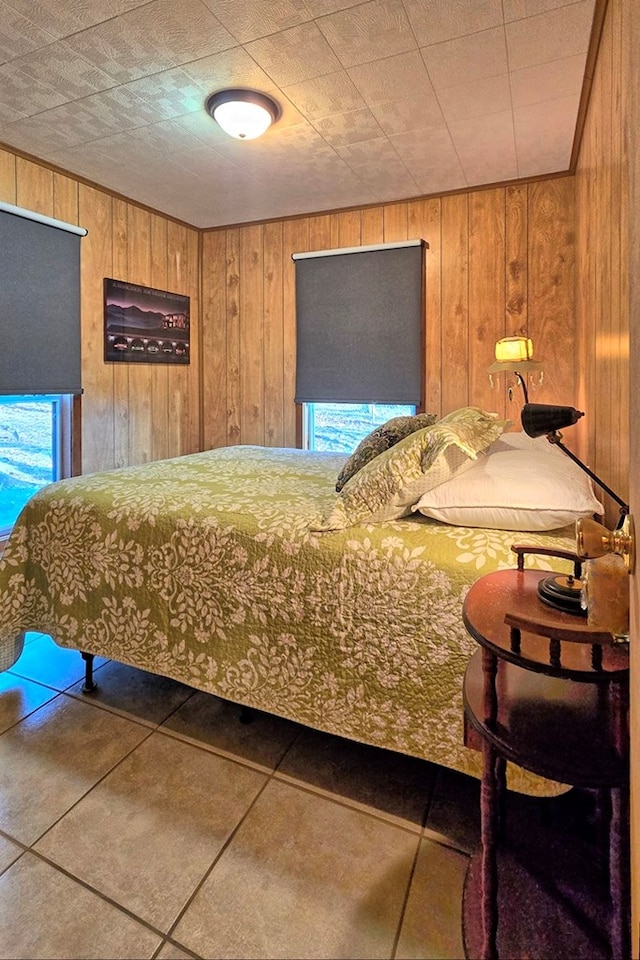 unfurnished bedroom featuring tile patterned floors and wooden walls