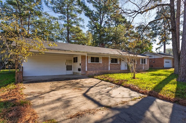 ranch-style home with a carport and a front lawn