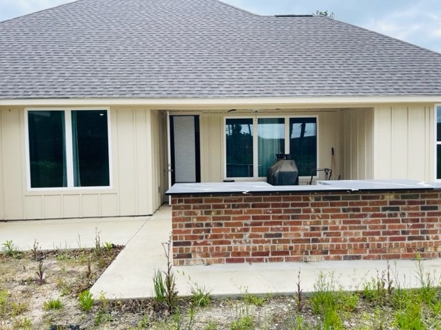 back of property with a patio area