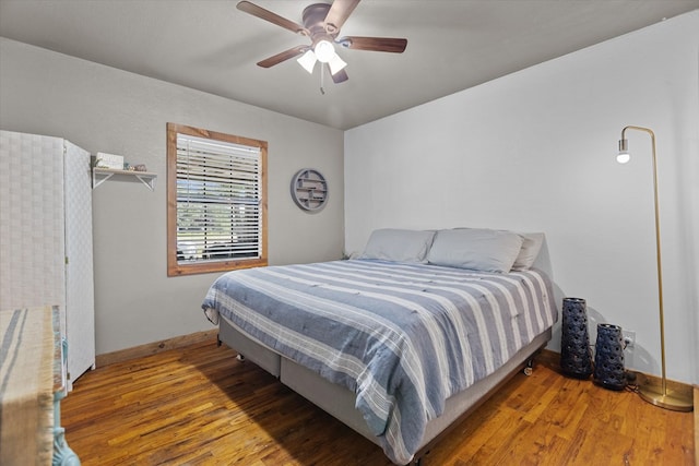 bedroom featuring ceiling fan and hardwood / wood-style floors