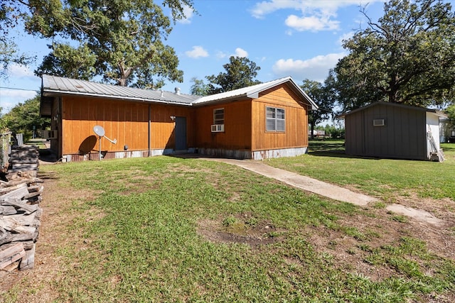 exterior space with a yard and a storage shed