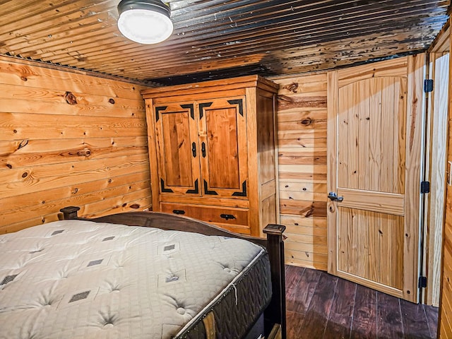 unfurnished bedroom with wooden ceiling, dark wood-style floors, and wood walls