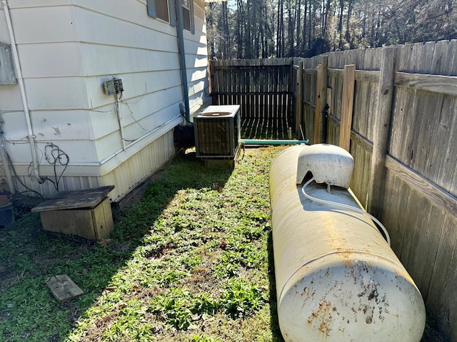 view of yard featuring central air condition unit