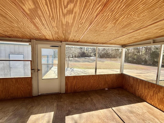 unfurnished sunroom with wood ceiling