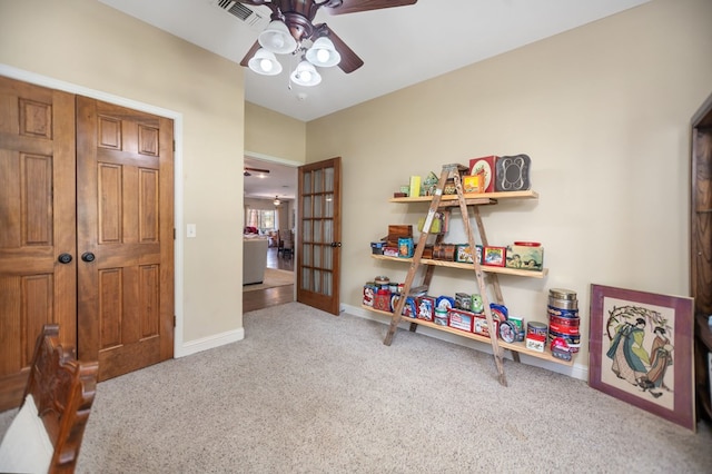 recreation room with baseboards, visible vents, carpet, and ceiling fan