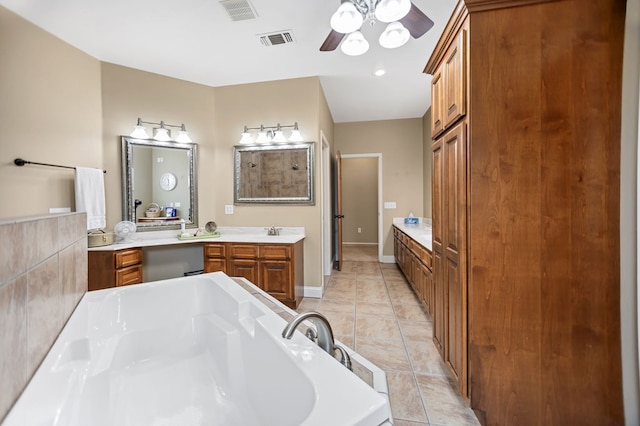 bathroom with visible vents, a garden tub, vanity, and ceiling fan
