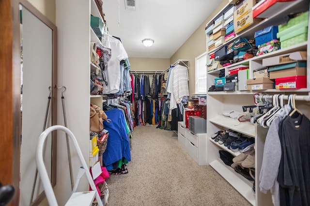 spacious closet with carpet floors and visible vents
