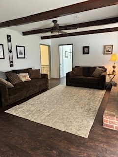 living room featuring dark hardwood / wood-style floors, ceiling fan, and beam ceiling