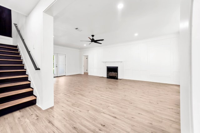 508 Jefferson Ave, Lufkin, TX 74904 - unfurnished living room featuring a ceiling fan, light wood-type flooring, stairway, recessed lighting, and ornamental molding