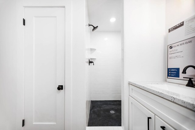 508 Jefferson Ave, Lufkin, TX 74904 - full bathroom featuring tiled shower and vanity